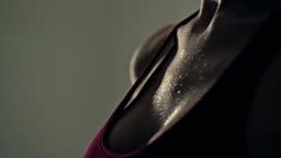 The beautiful female sporty body in the gym