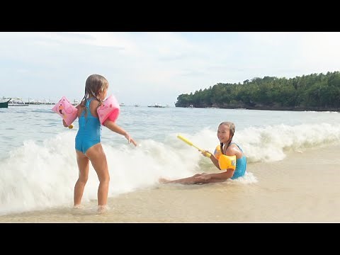 Children have fun on the beach 4k