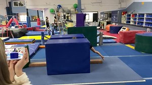 Coach Megan working with Sophia on “T”-ing out of her cartwheel. | Gymnastics World