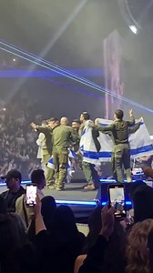 IDF soldiers dancing with Eden Hasson on stage singing "Am Yisrael Chai" | Uri Gobey