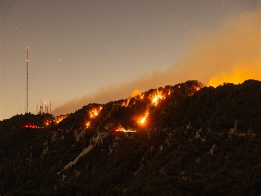 Five dead and thousands displaced as wildfires threaten Los Angeles area