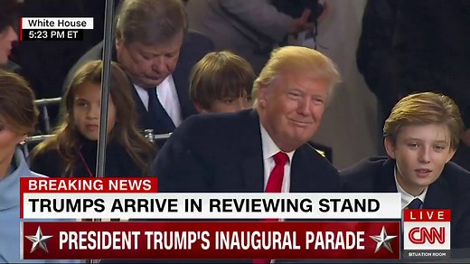 President Donald J. Trump and First Son Barron share a moment while sitting in the review stand right outside The White House http://cnn.it/2jWH2tg | CNN