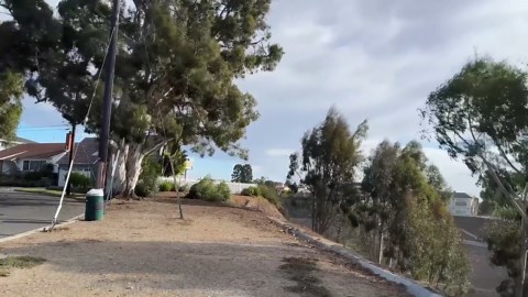 Palisades Fire smoke rises above homes along Piedra Morada Drive