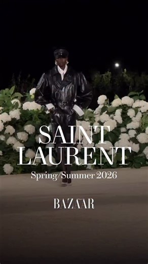 @anthonyvaccarello lit up the first night of Paris Fashion Week with his spring/summer 2026 show. With the Eiffel Tower as his backdrop, the designer showed a collection of sharp shoulders, translucent trench coats, and billowing gowns. | Harper's Bazaar