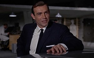 “Ejector seat? You’re joking.” Q gives Bond a tour of the gadgets on his Aston Martin DB5 in GOLDFINGER. | James Bond 007