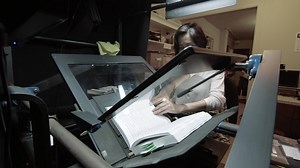 At the Internet Archive, this is how we digitize a book. We never destroy a book by cutting off its binding. Instead, we digitize it the hard way--one page at a time. We use the Scribe, a machine our engineers invented, along with the software that it runs. Our scanning centers are located in universities and libraries around the world, from Boston Public Library to the University of Toronto. Eliza is one of our fastest and most accurate scanners. Next she will execute quality control checks and